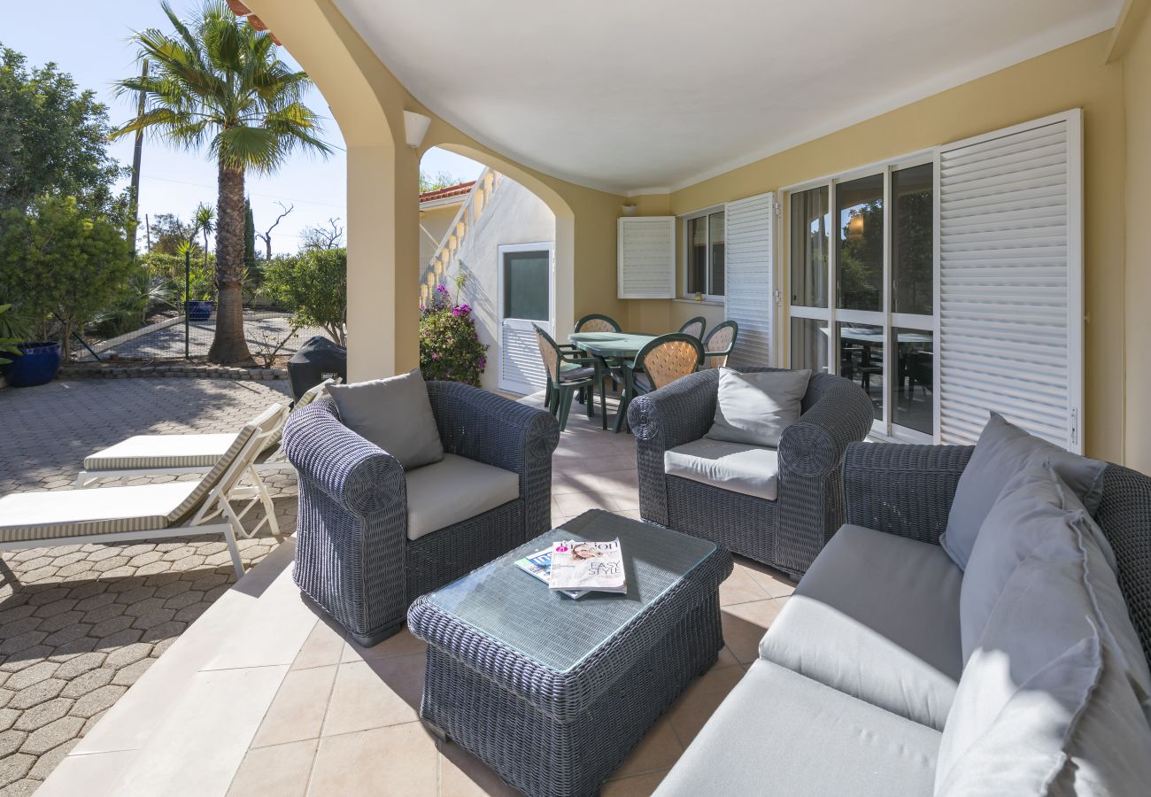 Exterior patio with sofa, armchairs, loungers and dining facilities