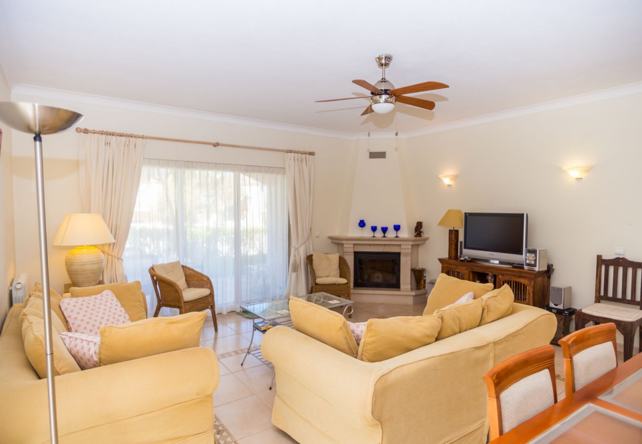 living room, ceiling fan, flat-screen tv, sofas, fireplace