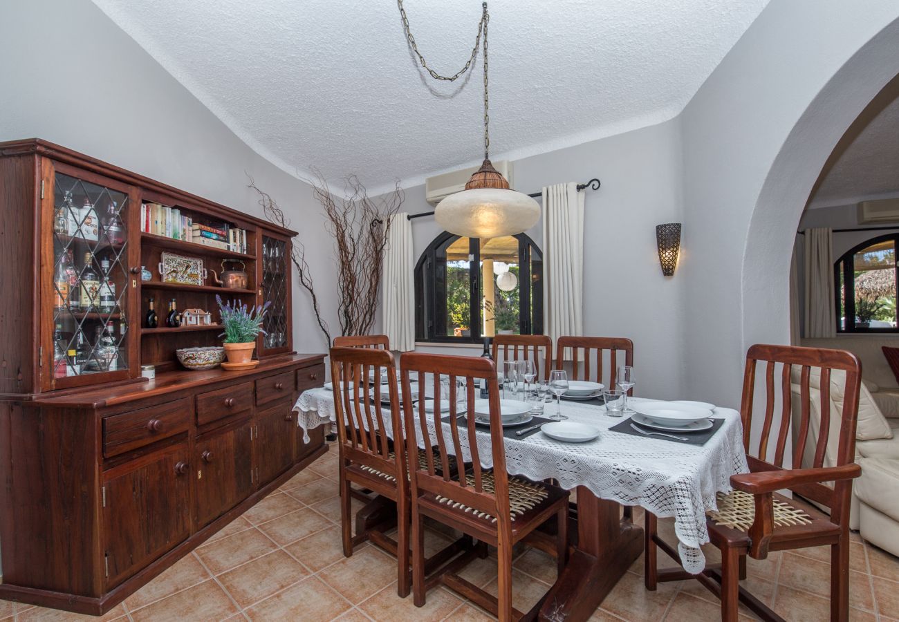 DIning area with dresser and access to the living room