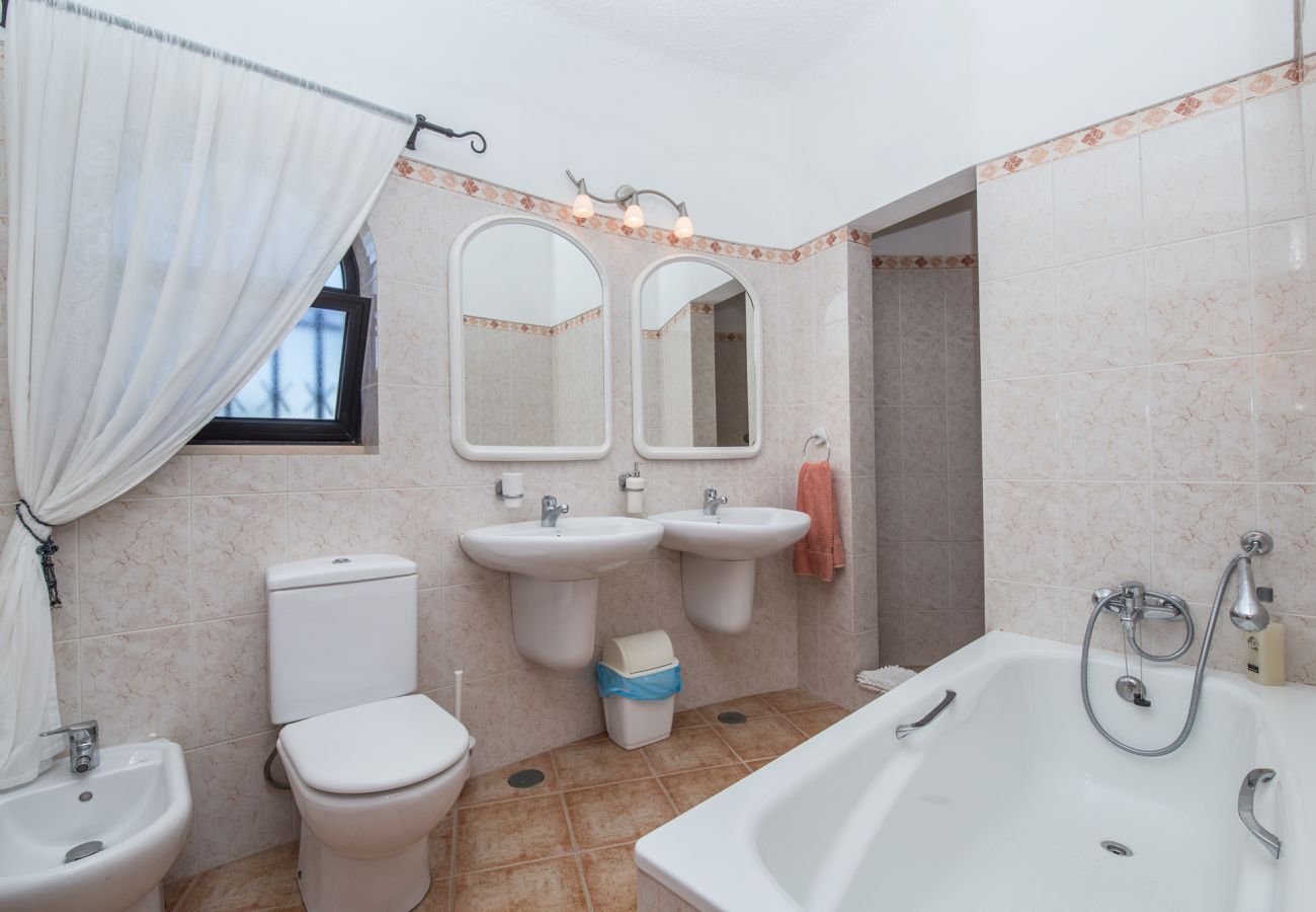 Double bedroom en-suite bathroom with bath, 2 basins and walk-in shower