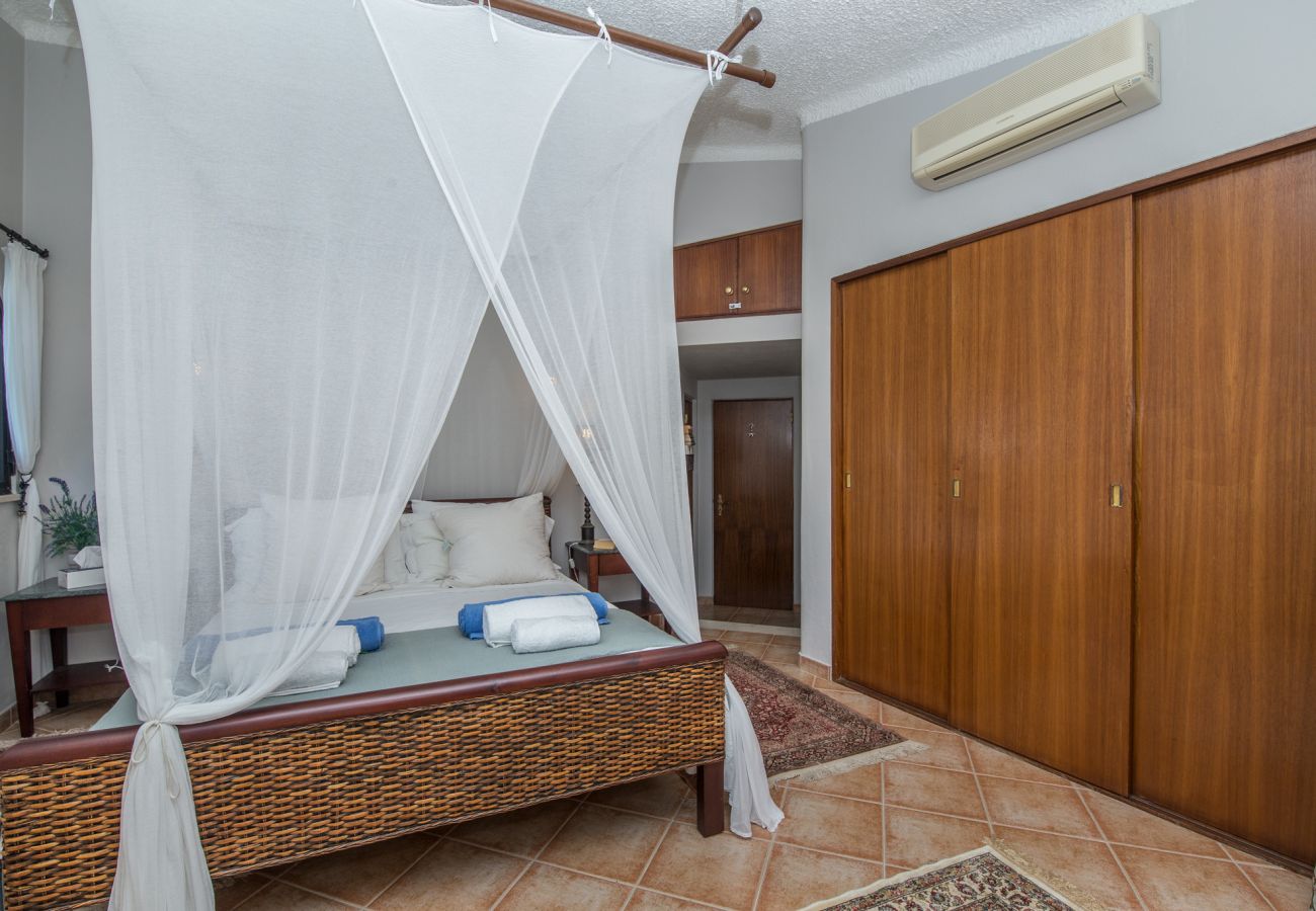 Master bedroom with plenty of wardrobe space and air conditioning