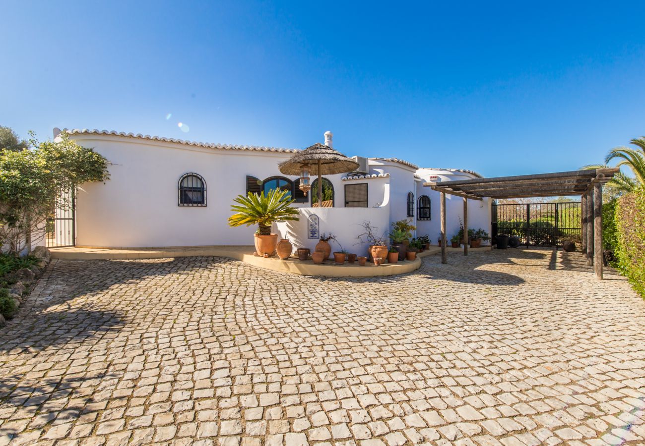 driveway, car port and villa