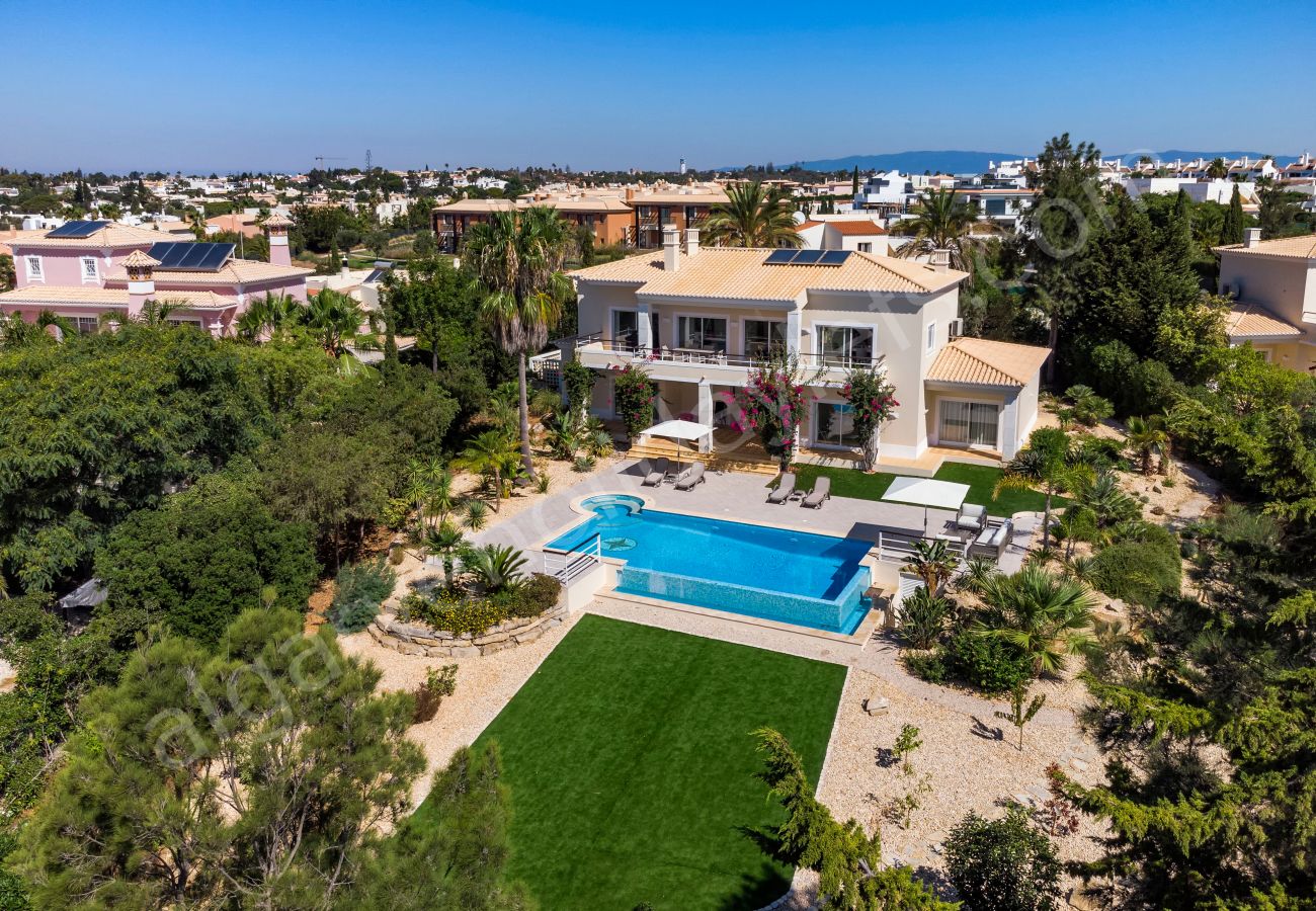 Aerial view of Villa Eden showing pool, garden, loungers and terrace in Carvoeiro