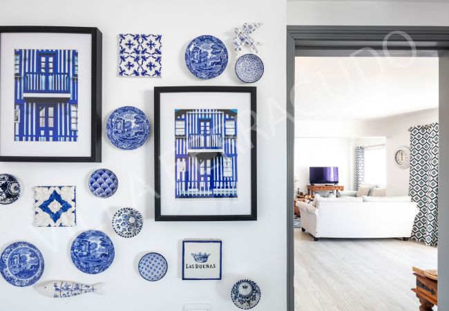Blue and white tile decor in Ferragudo holiday rental. Villa Ferragudo tile wall with living room view.